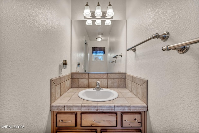 8030 Verde Ct, Winnemucca, NV 89445 - bathroom featuring a textured wall and vanity