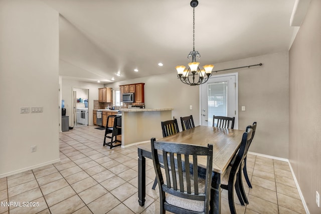 8030 Verde Ct, Winnemucca, NV 89445 - dining area featuring light tile patterned floors, recessed lighting, a chandelier, and lofted ceiling