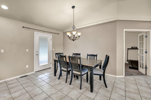 8030 Verde Ct, Winnemucca, NV 89445 - dining room with a chandelier, light tile patterned floors, lofted ceiling, and french doors