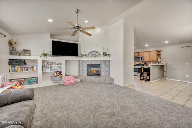 8030 Verde Ct, Winnemucca, NV 89445 - living area with recessed lighting, a ceiling fan, a tiled fireplace, light carpet, and light tile patterned floors