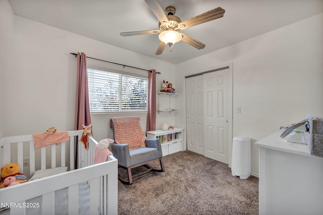 8030 Verde Ct, Winnemucca, NV 89445 - bedroom with carpet flooring, a closet, a nursery area, and a ceiling fan