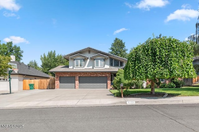 2126 Thomas Jefferson Dr, Reno, NV 89509 - view of front of house with brick siding, a garage, and concrete driveway