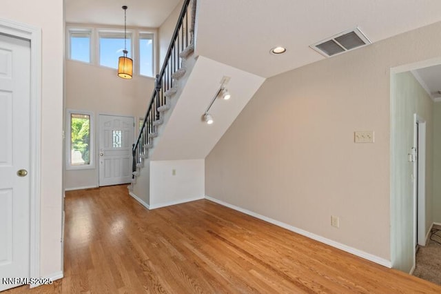 2126 Thomas Jefferson Dr, Reno, NV 89509 - foyer entrance featuring wood finished floors, stairs, and vaulted ceiling