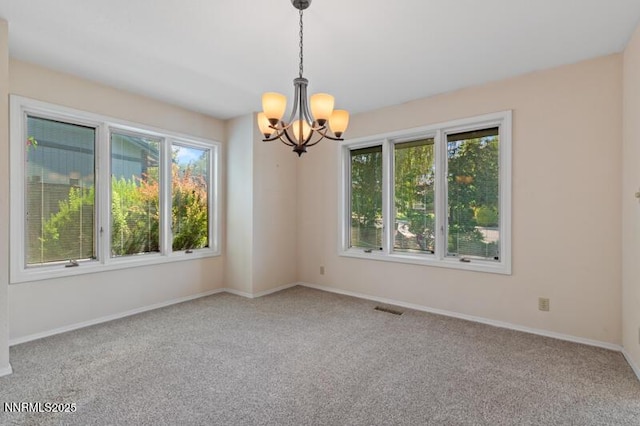 2126 Thomas Jefferson Dr, Reno, NV 89509 - carpeted empty room featuring a chandelier and baseboards