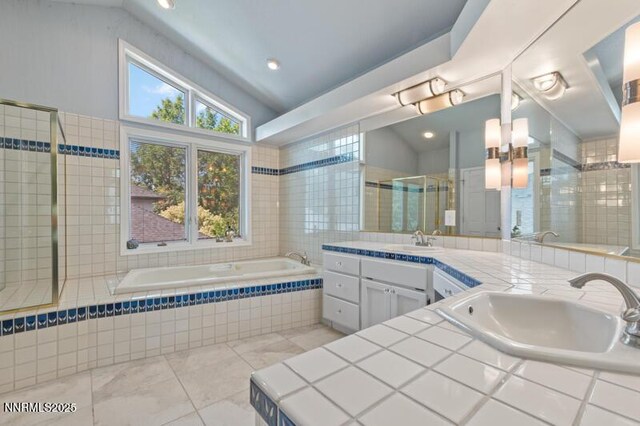 2126 Thomas Jefferson Dr, Reno, NV 89509 - full bath featuring double vanity, a bath, vaulted ceiling, and tiled shower