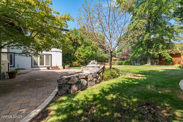 2126 Thomas Jefferson Dr, Reno, NV 89509 - view of green lawn with a patio