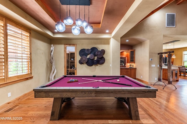 48 Rose Creek Ln, Reno, NV 89511 - playroom featuring wood finished floors, arched walkways, billiards, and a tray ceiling