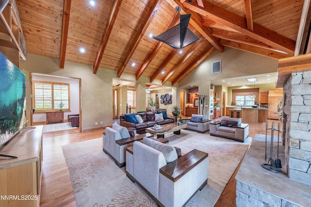 48 Rose Creek Ln, Reno, NV 89511 - living area featuring a wooden ceiling with exposed beams, high vaulted ceiling, arched walkways, light wood finished floors, and recessed lighting