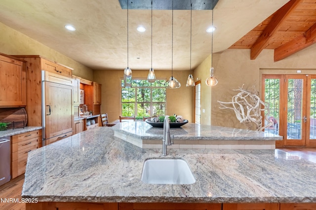 48 Rose Creek Ln, Reno, NV 89511 - kitchen featuring paneled built in fridge, a large island with sink, light wood-style flooring, recessed lighting, and french doors