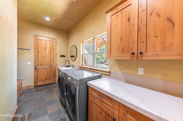 48 Rose Creek Ln, Reno, NV 89511 - washroom with cabinet space, washing machine and dryer, dark stone finish floors, and recessed lighting