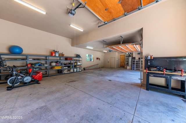 48 Rose Creek Ln, Reno, NV 89511 - garage with a workshop area and a garage door opener