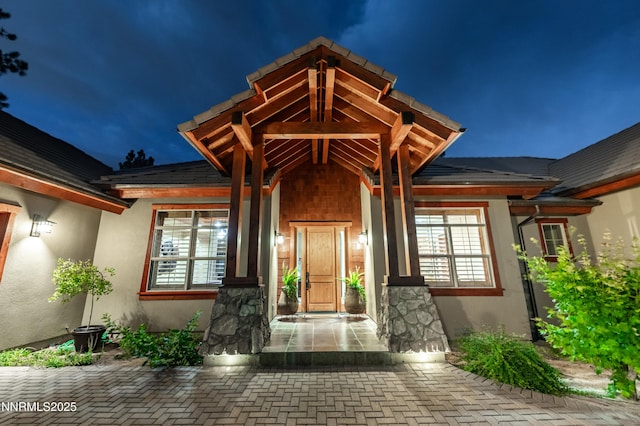 48 Rose Creek Ln, Reno, NV 89511 - exterior entry at night with stucco siding