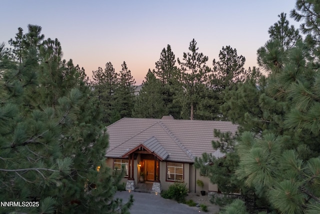 48 Rose Creek Ln, Reno, NV 89511 - view of front of property with a tile roof and stucco siding
