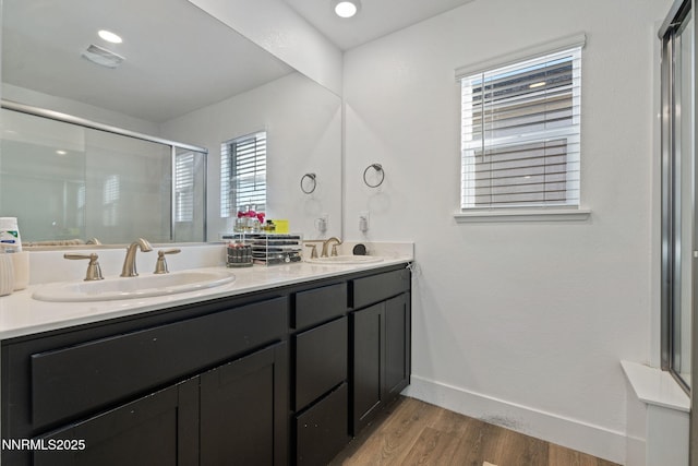 1413 Solitude Trl, Reno, NV 89523 - bathroom with double vanity, wood finished floors, and a shower stall