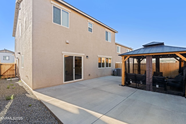 1413 Solitude Trl, Reno, NV 89523 - back of property featuring a gazebo, stucco siding, a patio area, and a fenced backyard