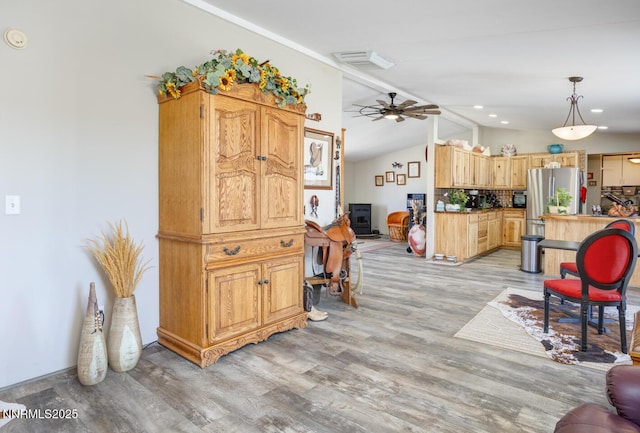 6297 Cox Rd, Fallon, NV 89406 - living area featuring vaulted ceiling, light wood-style flooring, a ceiling fan, and recessed lighting