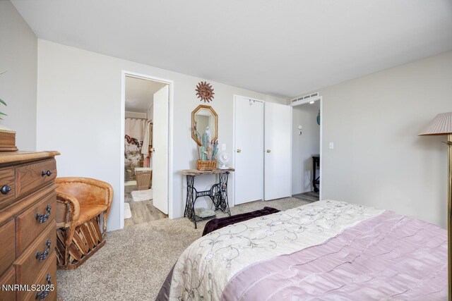 6297 Cox Rd, Fallon, NV 89406 - bedroom with light colored carpet and connected bathroom