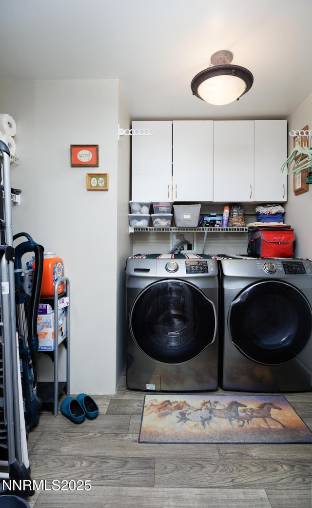 6297 Cox Rd, Fallon, NV 89406 - laundry room with cabinet space, washing machine and clothes dryer, and wood finished floors