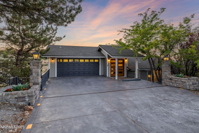 3575 Cashill Blvd, Reno, NV 89509 - view of front of home featuring concrete driveway, a garage, roof with shingles, and a gate