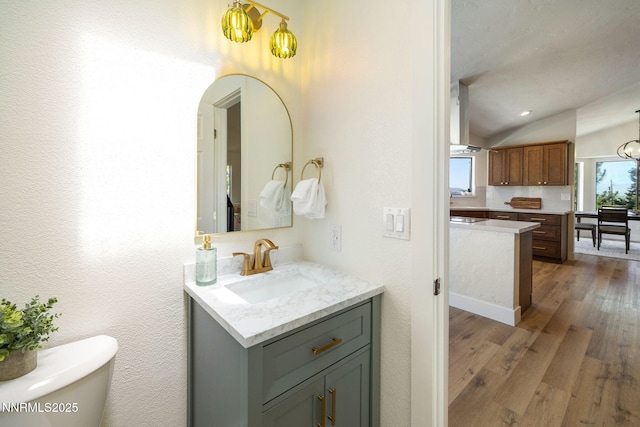 3575 Cashill Blvd, Reno, NV 89509 - bathroom featuring vanity, wood finished floors, and lofted ceiling
