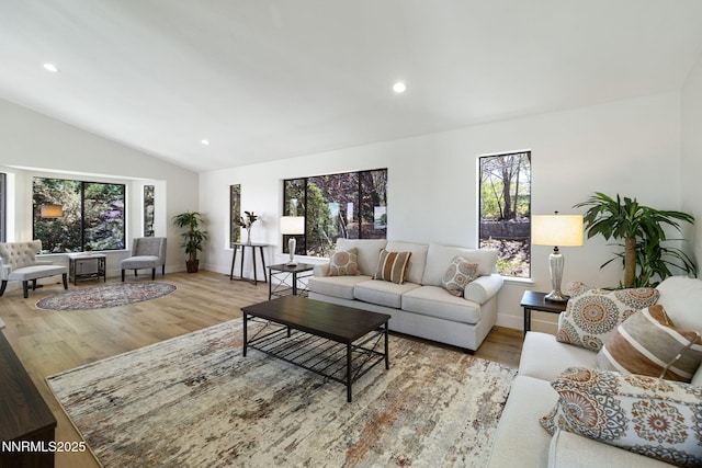 3575 Cashill Blvd, Reno, NV 89509 - living room with vaulted ceiling, wood finished floors, and recessed lighting