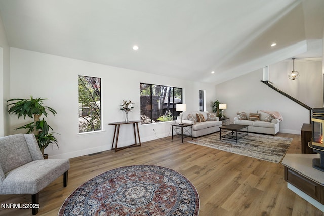 3575 Cashill Blvd, Reno, NV 89509 - living area with vaulted ceiling, wood finished floors, and recessed lighting