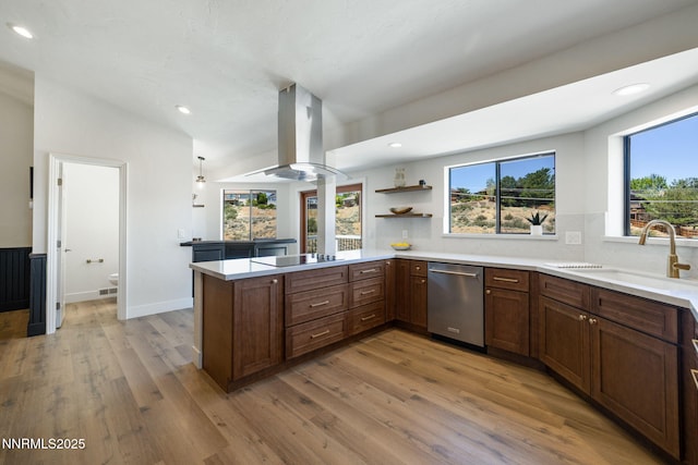 3575 Cashill Blvd, Reno, NV 89509 - kitchen with stainless steel dishwasher, island exhaust hood, healthy amount of natural light, light wood-style flooring, and recessed lighting