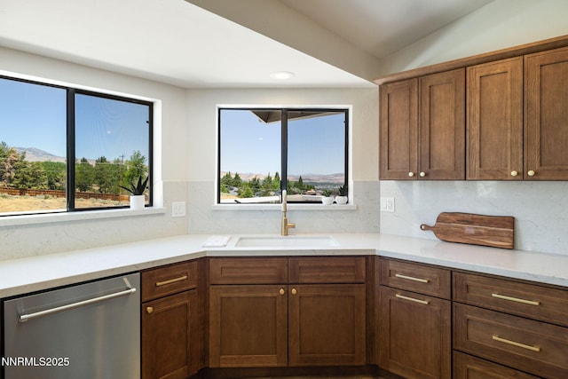 3575 Cashill Blvd, Reno, NV 89509 - kitchen featuring stainless steel dishwasher, tasteful backsplash, recessed lighting, light stone counters, and a mountain view