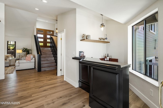 3575 Cashill Blvd, Reno, NV 89509 - indoor wet bar featuring light wood-style flooring, recessed lighting, stairs, and decorative light fixtures