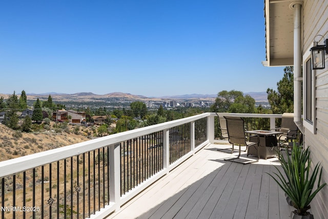 3575 Cashill Blvd, Reno, NV 89509 - wooden deck with a mountain view and an outdoor fire pit
