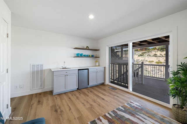 3575 Cashill Blvd, Reno, NV 89509 - indoor wet bar with fridge, light wood-type flooring, and recessed lighting