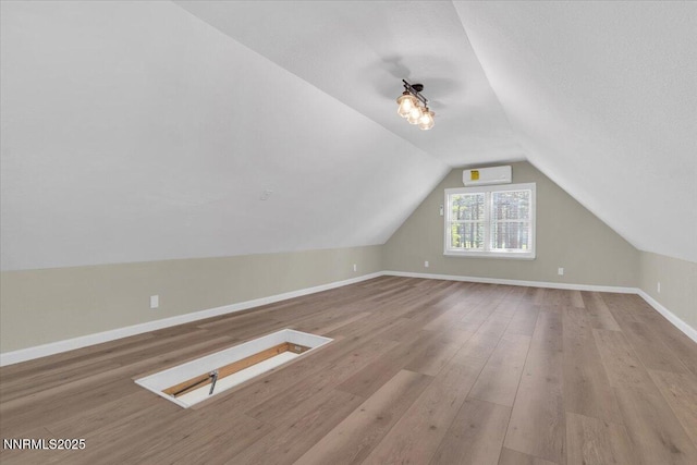 1094 Johnson Blvd, South Lake Tahoe, CA 96150 - bonus room featuring lofted ceiling, wood finished floors, and an AC wall unit