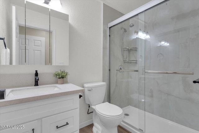 1094 Johnson Blvd, South Lake Tahoe, CA 96150 - full bathroom featuring vanity, a shower stall, and wood finished floors
