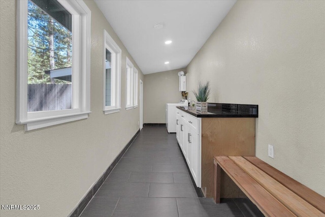 1094 Johnson Blvd, South Lake Tahoe, CA 96150 - corridor with washer / dryer, plenty of natural light, tankless water heater, recessed lighting, and a textured wall