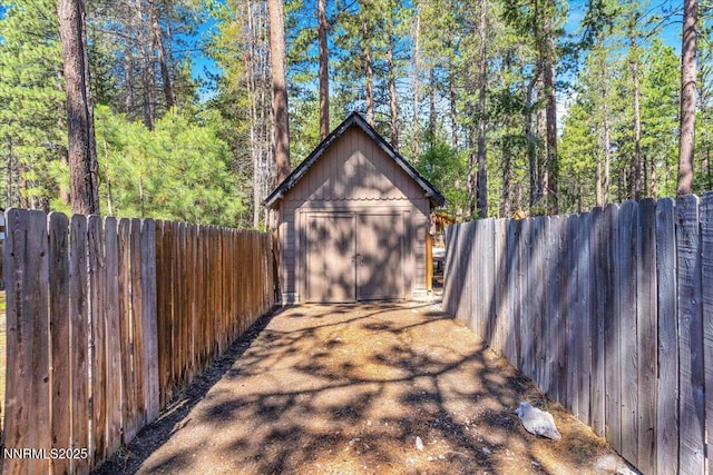 1094 Johnson Blvd, South Lake Tahoe, CA 96150 - garage with a shed and a forest view