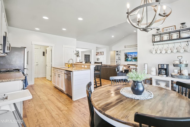 3287 Hackamore Way, Winnemucca, NV 89445 - dining area featuring recessed lighting, light wood-style floors, a chandelier, and vaulted ceiling