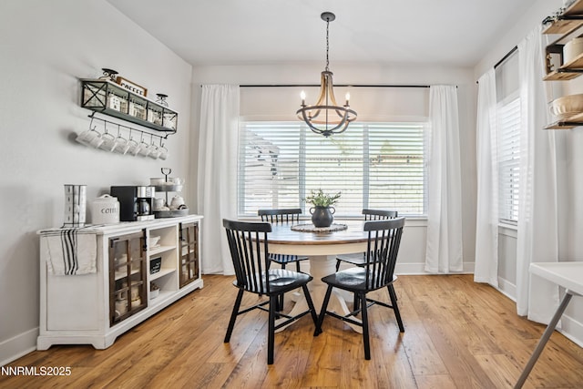 3287 Hackamore Way, Winnemucca, NV 89445 - dining area featuring a chandelier and light wood-style flooring
