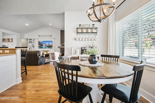 3287 Hackamore Way, Winnemucca, NV 89445 - dining area featuring a chandelier, light wood-type flooring, vaulted ceiling, and recessed lighting