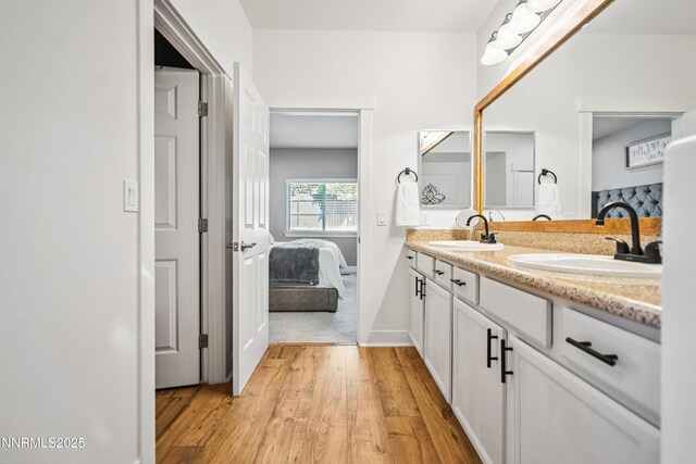 3287 Hackamore Way, Winnemucca, NV 89445 - ensuite bathroom featuring wood finished floors and double vanity
