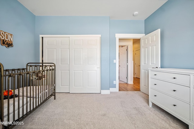 3287 Hackamore Way, Winnemucca, NV 89445 - bedroom with light carpet, a closet, and a crib