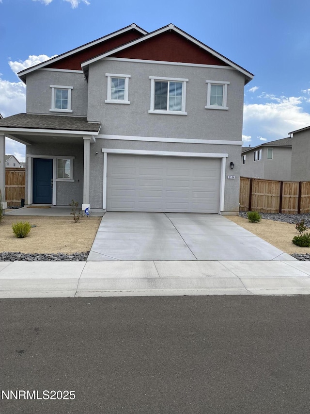 9144 Sturgeon Moon Dr, Reno, NV 89506 - traditional home with driveway, stucco siding, a garage, and covered porch