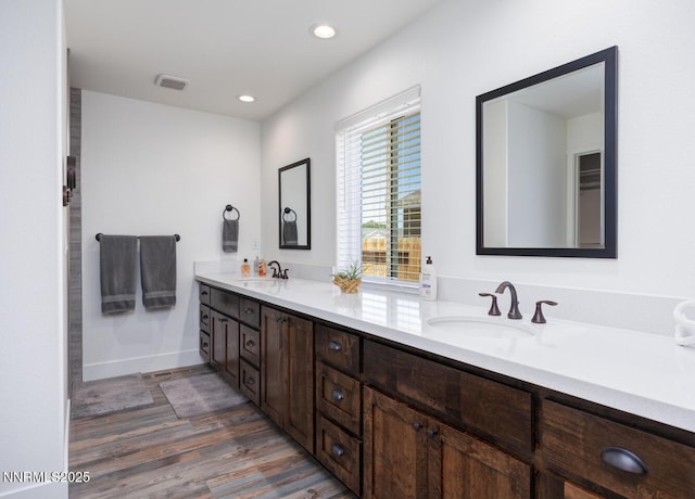 776 Kinsli St, Fallon, NV 89406 - full bathroom featuring wood finished floors, double vanity, and recessed lighting