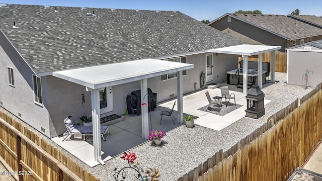 776 Kinsli St, Fallon, NV 89406 - rear view of house with a hot tub, stucco siding, and a fenced backyard