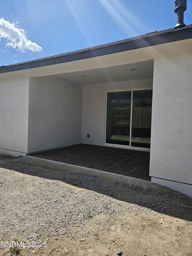 1205 Spur Way, Gardnerville, NV 89410 - rear view of property featuring a patio and stucco siding