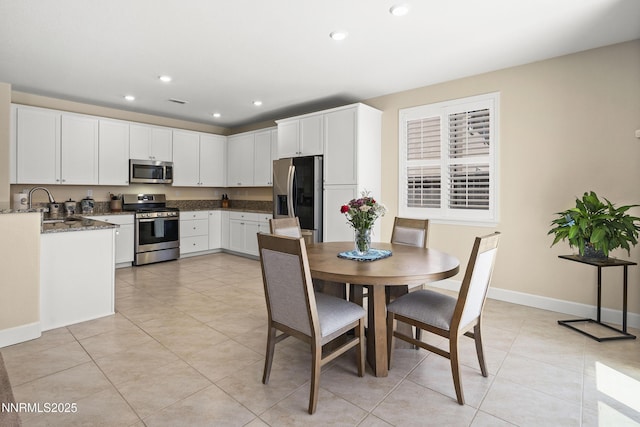 7106 Owl Vw Dr, Sparks, NV 89436 - dining area with light tile patterned flooring and recessed lighting