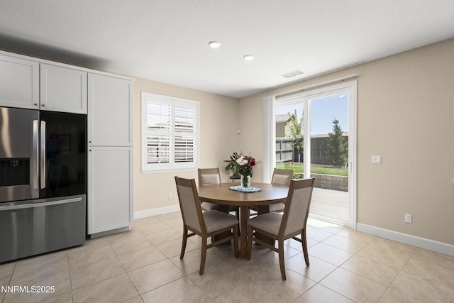 7106 Owl Vw Dr, Sparks, NV 89436 - dining room with plenty of natural light and light tile patterned floors