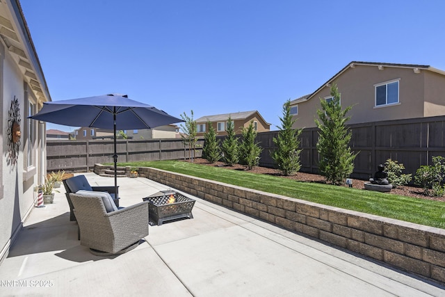 7106 Owl Vw Dr, Sparks, NV 89436 - fenced backyard with an outdoor fire pit and a patio area