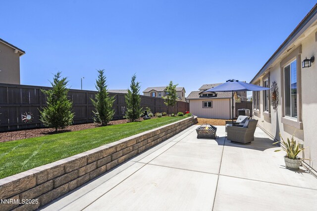 7106 Owl Vw Dr, Sparks, NV 89436 - fenced backyard with a fire pit, a patio, a residential view, and a storage unit