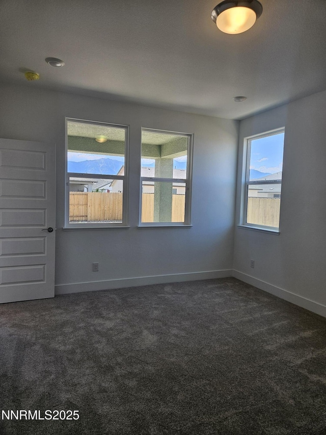 1219 Heybourne Rd, Gardnerville, NV 89410 - spare room with dark carpet and a smoke detector