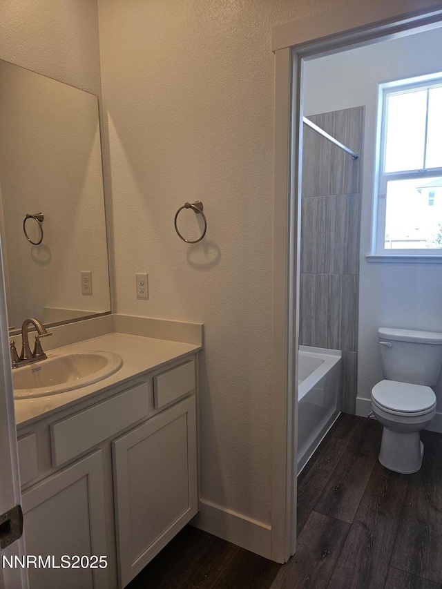 1219 Heybourne Rd, Gardnerville, NV 89410 - full bathroom featuring vanity, wood finished floors, and shower / washtub combination